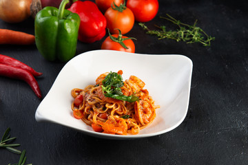 delicious spaghetti with shrimps, tomatoes, basil and cheese