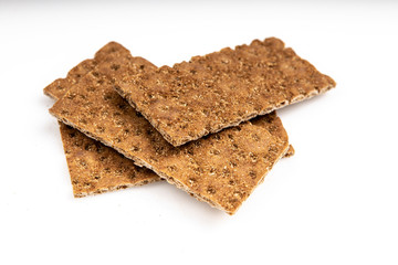 Grain diet light crisp bread lying on a white background