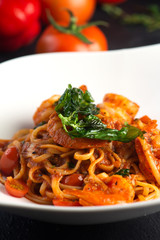 Pasta with meat, tomato sauce and vegetables