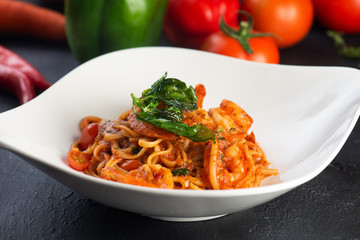 Pasta with meat, tomato sauce and vegetables
