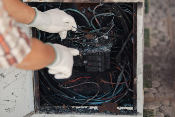 The technician is investigating the cause of the fire, short circuit, electric shock, electric...