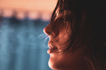 portrait of a man throwing smoke