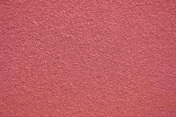 Fototapeta premium Red horizontal wall covered with plaster texture