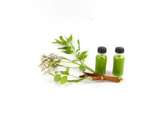Ayurvedic herbs, Azadirachta indica or neem leaves and neem leaf juice. And branches on a white background.