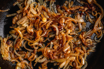 Caramelized onion with anise and cinnamon spices. Selective focus. Shallow depth of field.