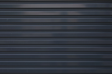 black roller shutter door closed security background