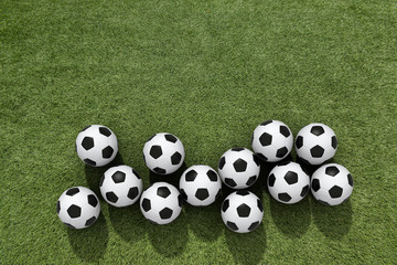 Top view white soccer ball with line on soccer field background.
