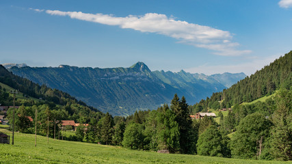 Fototapeta na wymiar Switzerland, Panoramic view on green Alps near Schynige Platte, Saxeten