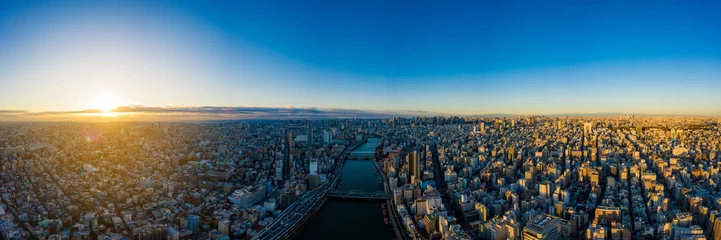 Fotobehang Luchtpanorama door drone van Tokyo Cityscape op zonsopgang. in Tokio, Japan. © FocusStocker