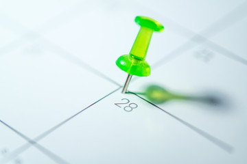 Green push pin calendar on 28th of March - Earth Hour
