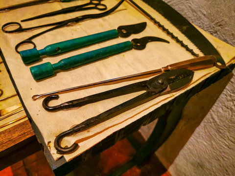 Set Of Colonial Vintage Medical Instruments On A White Cloth. The Concept Of The Past Medicine.