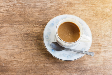 cup of coffee on wooden table