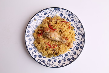 plate of rice with chicken and peppers