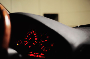 The old tachometer with orange light