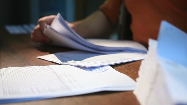 Office worker man working with documents at the table