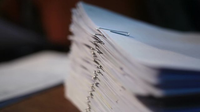 Office worker man working with documents at the table