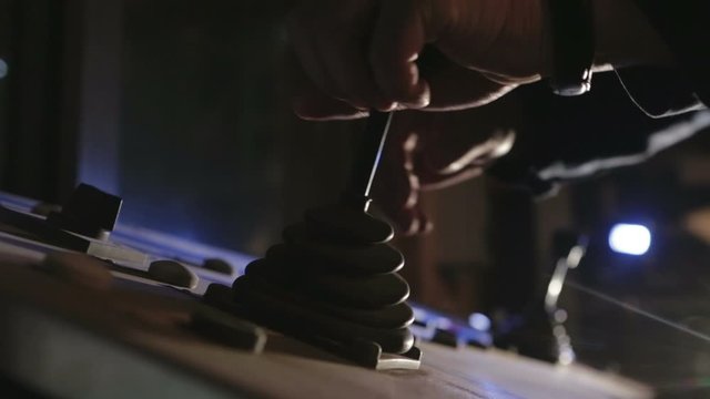 Man working at the controls levers