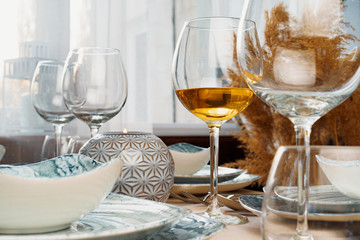 Table setting with stylish dishware on beige tablecloth