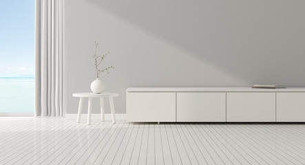View of minimal living room with empty grey wall, Interior design with small white table and plant in vase, white laminate cabinet on wood floor on sea view background, 3d rendering.  © nuchao