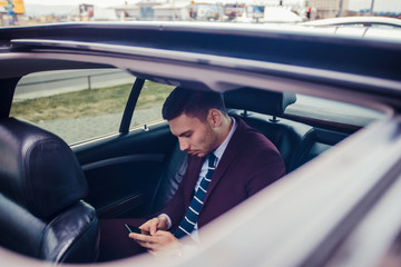 Businessman looking in his mobile