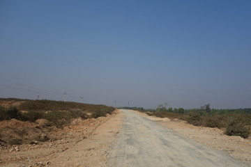 A rural village earthen road in India.