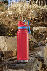Thermos Bottle and water bottle in outdoor settings.