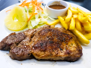 Steak on a white plate
