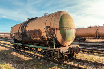 Grunge petroleum waggon on the railroad