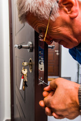 Workman fixing the door knob