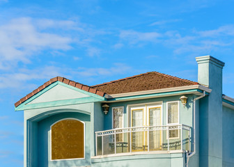 The roof of the house with nice window.