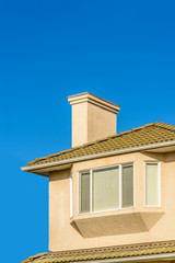 The roof of the house with nice window.