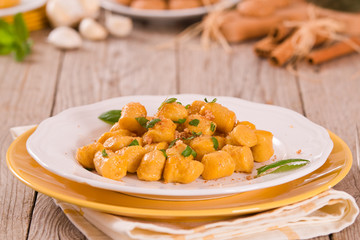 Pumpkin gnocchi with grated amaretti cookies.