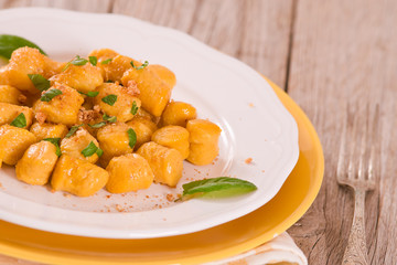 Pumpkin gnocchi with grated amaretti cookies.