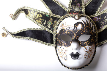  Black and white masquerade mask on a white background