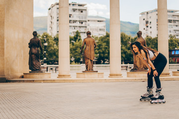 Woman wearing roller skates riding in town