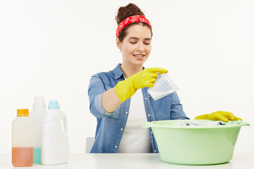 Beautiful woman in her work-wear sits at the table.