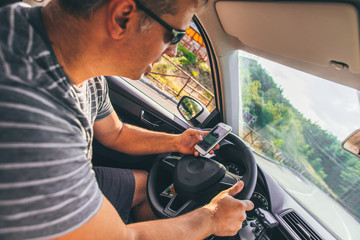 Man driving at risk while using cellphone in the car