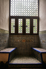 Spanish Style Benches made out of colorful tiles by a Window