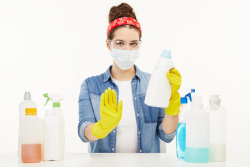 Beautiful woman in her work-wear sits at the table.