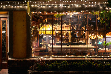 Store Front of an Antique Store at Night After hours