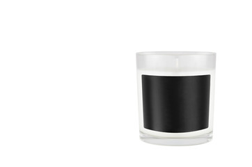White candle in transparent glass with black blank label on isolated, mock up for branding identity...