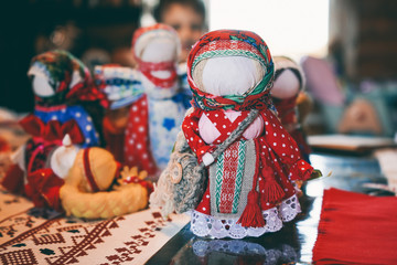 Traditional folk doll amulet made of fabric. Vintage toys for children.