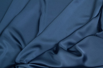 Fabric satin silk drapery. Blue textile