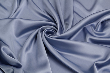 Fabric satin silk drapery. Blue textile