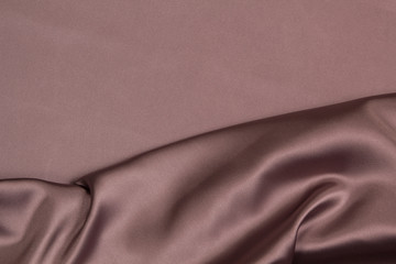 Fototapeta premium Fabric satin silk drapery. Purple textile
