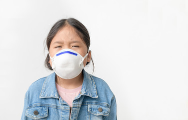 Asian  girl wear N95 mask to protect PM 2.5 dust and air pollution