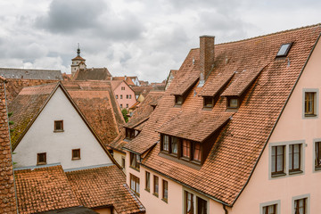 Fototapeta na wymiar A view of the traditional German houses and roofs in Rothenburg ob der Tauber in Germany.