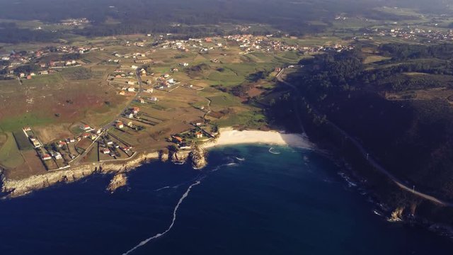 The coast of Playa Barizo, Spain, aerial drone view. Down to up tilt camera movement.