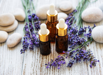 Fototapeta na wymiar Lavender oil and lavender flowers