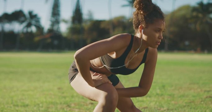 Athletic african american woman stretching before her workout outdoors, young confident african american woman living a healthy lifestyle